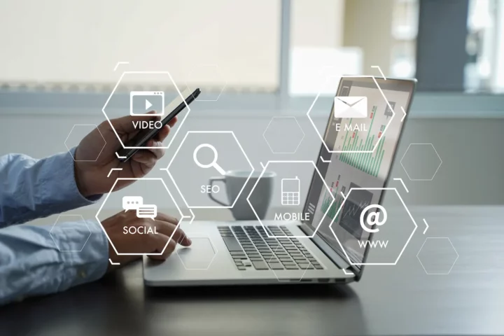 Working on laptop with social media overlay